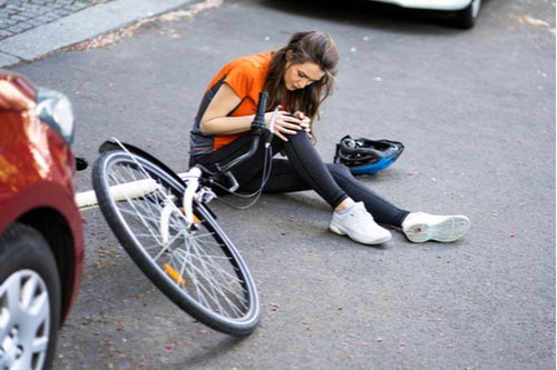 Young woman with bicycle accident injuries in Naples Florida