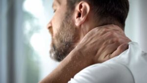 Middle-Aged Man Feeling Neck Pain in Morning 