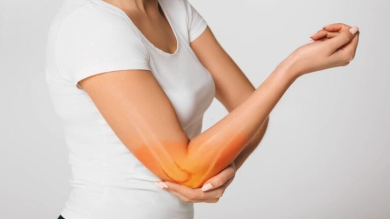 Woman Suffering Pain in the Elbow