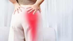 Woman Suffering from Buttock Pain Spreading Down Her Leg