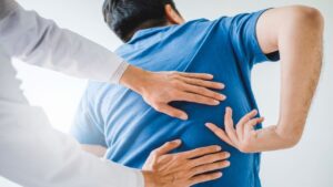 Chiropractor Consulting with a Patient About Back Problems