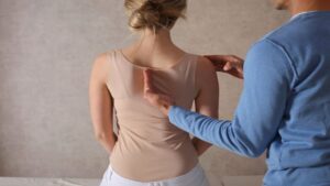 Woman with Scoliosis Undergo Treatment with a Chiropractor