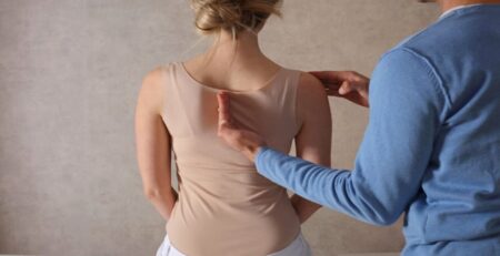 Woman with Scoliosis Undergo Treatment with a Chiropractor
