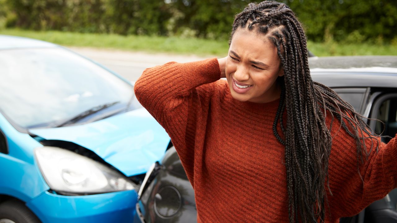 a woman suffering Whiplash due to car accident and needs Naples Whiplash Treatment